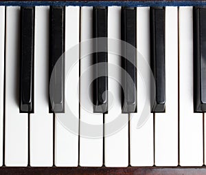 Old piano keys musical background. Acoustic musical instrument