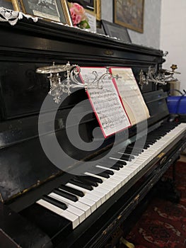 Old piano with notes, retro exposition