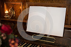 Old Piano with Open Blank Book with Copy Space