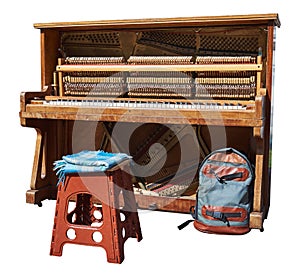 Old pianos for street musicians with the front panel removed