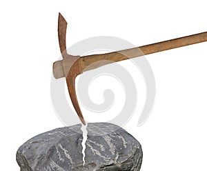 Old pick axe breaking rock isolated.