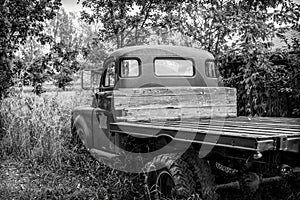 old pickup truck in field