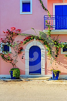Old pictorial greek door with flowers in Assos, Kefalonia, Ionian Islands, Greece