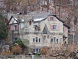 Old picturesque stone town residential villa in Weesen settlement on the shores of Lake Walen or Lake Walenstadt / Walensee
