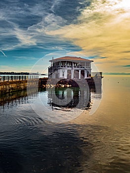 An old pier building in a part of Istanbul called Moda as part of the seascape. photo