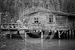 Old pier at lake of Braies in black and white