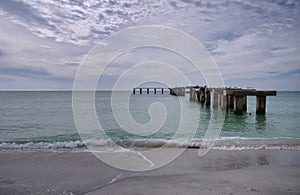 Old pier pilings at Boca Grande Pass Beach