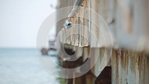 Old pier sea waves on the water.