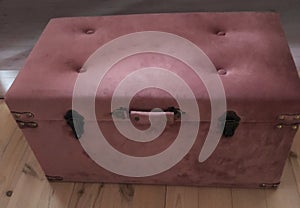 old pink big vintage velours box on wood floor