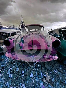 Old pink scrap car photo