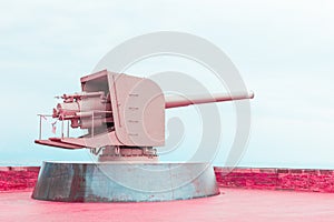 Old pink metal cannon, concept of peace and cessation of war