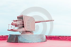 Old pink metal cannon, concept of peace and cessation of war photo