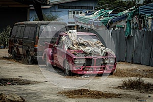 Old pink pickup truck abandoned in wasteland