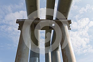 The old pipe on a background of blue sky with white clouds