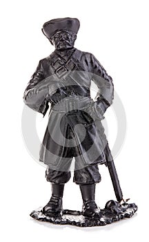 Old pirate captain in authentic looking costume close-up isolated on a white background. Miniature figurine of a children's toy.