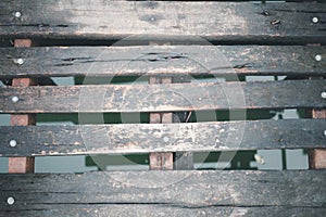 Old planks wood pathway over of canal