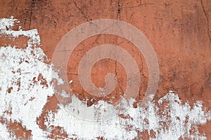 Old plaster texture. Cracked white red brown concrete wall