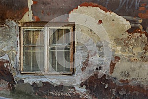 Old plaster wall and cracked brick background with vintage window