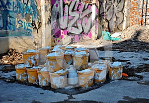 Old plastic cans on the site