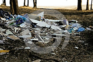 Old plastic garbage in forest, big mountain with nobody care of nature, modern environment trash concept