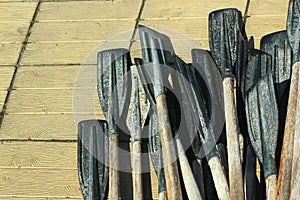 Old plastic oars on wooden floor