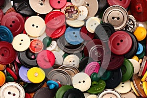 Old plastic sewing buttons as background