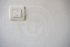 Plastic switch on a white wall