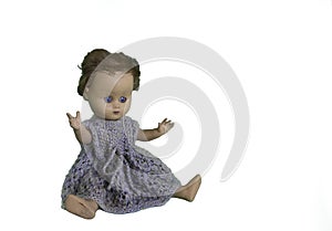 Old play doll with short hair and hands in the air. isolated