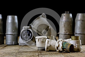 Old plug and socket high voltage. Old electrical accessories. Wooden table.