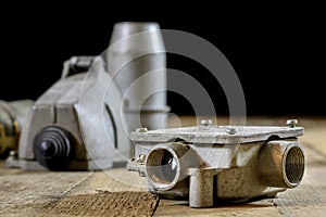 Old plug and socket high voltage. Old electrical accessories. Wooden table.