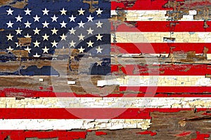 Old plumbed America flag on wood.