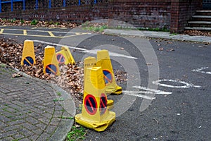 Old police cones discarded in the street