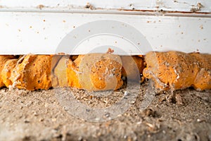 Old polyurethane foam close-up. Corrosion and destruction of building foam photo