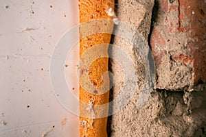 Old polyurethane foam close-up. Corrosion and destruction of building foam photo