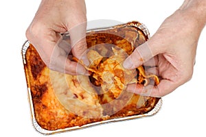 Old poor man eat with hands  fat  meat pork  lasagna isolated macro