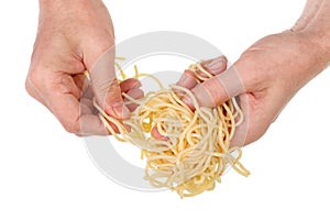 Old poor man eat with hands  long spaghetti pasta with fatty butter isolated macro