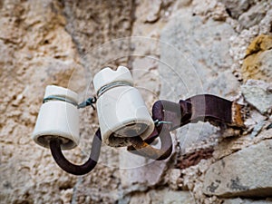 Old porcelain insulator of street light wires. photo