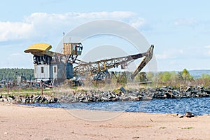 Old port crane on the lake shore
