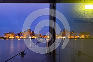 Old port of the German Hanseatic city of Wismar on the Baltic Sea reflected in a pane of glass