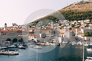 The old port harbor is porporela, near the walls of the old town of Dubrovnik, Croatia. Moored boats and yachts near the