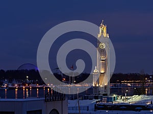 Old port of Montreal at night,with illuminated clock tower and Jacques Cartier and Saint Lawrence river