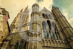 Old postcard with gothic facade of the Church of Our Lady, Bruges, Belgium