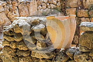 Old pot on an stone wall, archaeological park of Shiloh, Israel