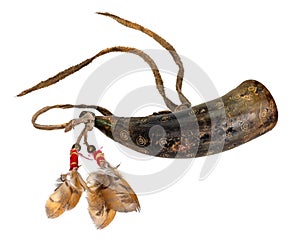 Old powder horn of the North American Indians made of horn decorated with deerskin and feathers