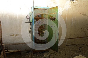 Old power distribution board. Premises of a destroyed and plundered milk production plant. The raiders captured the plant. Vandal