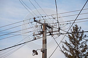 Old power electric line and a Street Lamp, with a power supply cable, made of an obsolete connection system to the public network