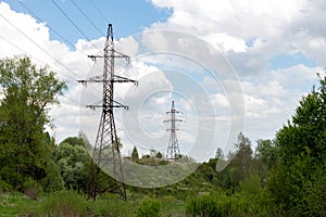 Old power lines against backdrop of nature in summer, Russia