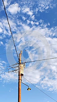 Old power pole and wire in summer day