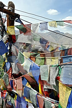 Old prayer flags with Himalaya in the background
