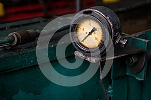 old pressure gauge on the pipeline